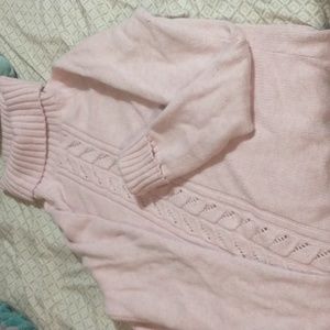 A pink sweater